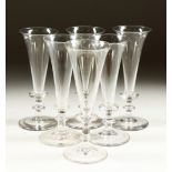 A SET OF SIX FLUTED WINE GLASSES.