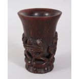 A CARVED HORN LIBATION CUP. 11cms.