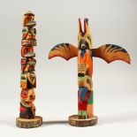 TWO SMALL BRITISH COLUMBIA CARVED WOOD TOTEM POLES. 19cms high.