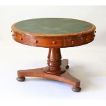A REGENCY OAK CIRCULAR DRUM TABLE, with inset leather top, alternate drawers, centre column