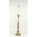 A LARGE ITALIAN METAL PRICKET CANDLESTICK, converted to a lamp with shade. 69cms high.