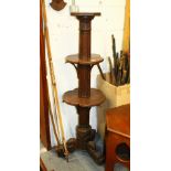 AN UNUSUAL OAK COLUMN STYLE TWO TIER DUMB WAITER, with carved and fluted column support on three