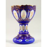 A GOOD BOHEMIAN BLUE AND GILT VASE, with white inside. 21cm high.