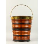 A DUTCH BRASS BOUND BANDED WOODEN BUCKET, with galvanised liner. 32cms high.