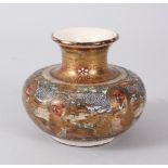 A SMALL 19TH CENTURY JAPANESE SATSUMA VASE, painted with a band of heads. 7cms high.