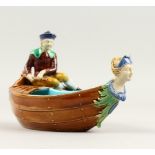 A VERY GOOD MINTON MAJOLICA TWO-DIVISION BOAT, with a man steering, the head as a female mask, the