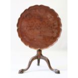 A CHIPPENDALE STYLE MAHOGANY TRIPOD TABLE, with piecrust top and bird cage support. 70cms diameter.