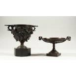 A BRONZE TWO-HANDLED URN on a marble base, 16cms high, and A BRONZE TWO-HANDLED TAZZA, 9cms high (