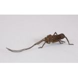 A JAPANESE BRONZE ARTICULATED LOCUST. 13cms.