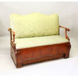 A RARE QUEEN ANNE WALNUT SETTEE, with padded serpentine back, curving arms, lift-up seat and panel