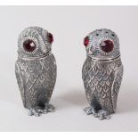 A PAIR OF OWL SALT AND PEPPERS.