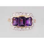 A 9CT GOLD, EMERALD CUT AMETHYST AND DIAMOND RING.