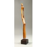 A MODERN CARVED OAK STANDING FIGURE, on a square base. 44cms high.