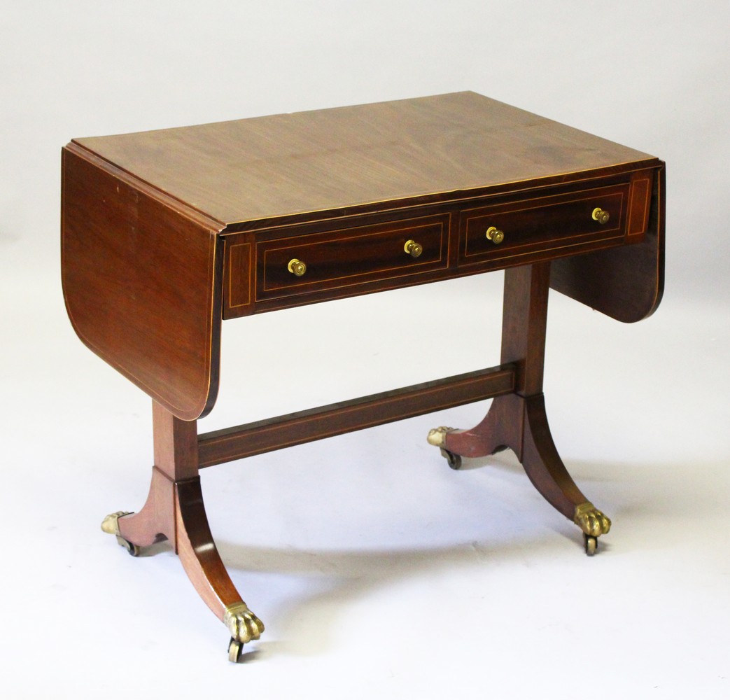 A GEORGIAN STYLE MAHOGANY INLAID SOFA TABLE, with folding flap, two small drawers, on end supports
