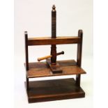 A VICTORIAN OAK BOOK PRESS with turned supports. 106cms high x 66cms wide.