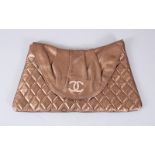 A CHANEL GOLD EVENING BAG.