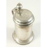 AN 18TH CENTURY LIDDED TANKARD, with plain sides, the lid engraved A.F 1768. 24cms high.