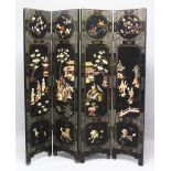 AN EARLY 20TH CENTURY CHINESE HARDSTONE & BONE ON LAID FOUR-FOLD LACQUERED WOOD SCREEN, each fold