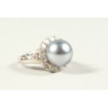 A SILVER, PEARL AND CZ RING.