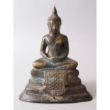 A 19TH CENTURY THAI BRONZE BUDDHA / DEITY, seated upon a triple pedestal base, the rear bearing some