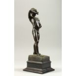 A. C. MOUDE A STANDING NUDE. Signed and dated 1913. 29cms high.