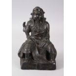 A MING DYNASTY BRONZE SEATED FIGURE OF GUANDI. 21cms high.
