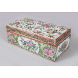 A GOOD CANTON CHINESE RECTANGULAR BOX AND COVER, painted with flowers and birds. 18cms long.