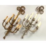 TWO VERY SIMILAR DESIGN SEVEN BRANCH SCROLLING WALL SCONCES, with ribbon motifs in silvered metal