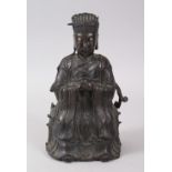 A MING DYNASTY BRONZE SEATED FIGURE OF AN OFFICIAL. 24cms high.