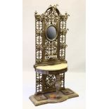 A SUPERB VICTORIAN COALBROOKDALE CAST IRON HALL STAND, with circular mirror to the back, seven