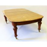 A VERY GOOD VICTORIAN POLLARD OAK DINING TABLE with five leaves, wind out top, with turned and