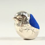 A SILVER CHUBBY BIRD PIN CUSHION.