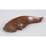 A JAPANESE BRONZE SCROLL WEIGHT MODELLED AS A FISH. 13cms.