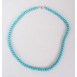 A TURQUOISE BEAD NECKLACE.