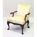A GEORGIAN MAHOGANY GAINSBOROUGH CHAIR, with panel back and seat, curving arms, on cabriole legs.