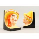 A PAIR OF ART DECO COLOURFUL BOOK ENDS. 15cms high.