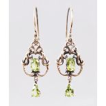 A PAIR OF 9CT GOLD PERIDOT SET DROP EARRINGS.