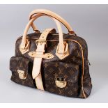 A LOUIS VUITTON BAG WITH SIDE POCKETS, in outer bag.