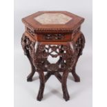 A SMALL 19TH CENTURY CHINESE HEXAGONAL FORM MARBLE TOP HARDWOOD TABLE / PLANTER, the top inset with