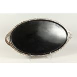 A MOTHER-OF-PEARL BANDED TWO-HANDLED OVAL TRAY. 70cms long.