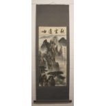 A CHINESE HANGING SCROLL PAINTING ON PAPER BY XIAN KE, painted with a panel of calligraphy above a