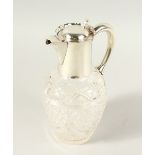 A SILVER MOUNTED CUT GLASS CLARET JUG. Birmingham 1912. 24cms high.