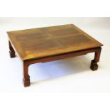 A CHINESE REDWOOD LOW COFFEE TABLE, with four panel top. 107cms x 82cms.
