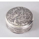 AN 18TH CENTURY PERSIAN QAJAR CIRCULAR SILVER BOX AND COVER, POSSIBLY ISFAHAN, the lid repousse with