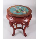 A CHINESE HARDWOOD VASE STAND, inset with a circular cloisonne panel. 51cms high.