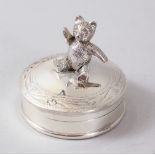 A NOVELTY SILVER PILL BOX, with articulated Teddy.