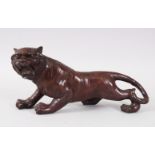 A JAPANESE BRONZE MODEL OF A TIGER. 30cms long.