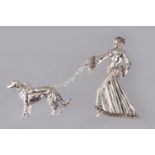 A SILVER ART DECO DESIGN DOG WALKING BROOCH.