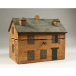 A PAINTED HOUSE TEA CADDY. 25cms long.