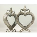 A PAIR OF DECORATIVE HEART SHAPE LANTERNS. 52cms high.